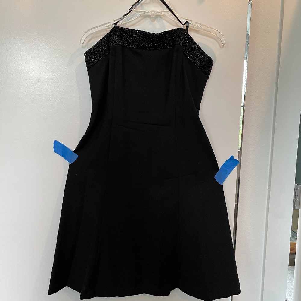 Strapless beaded black cocktail dress.